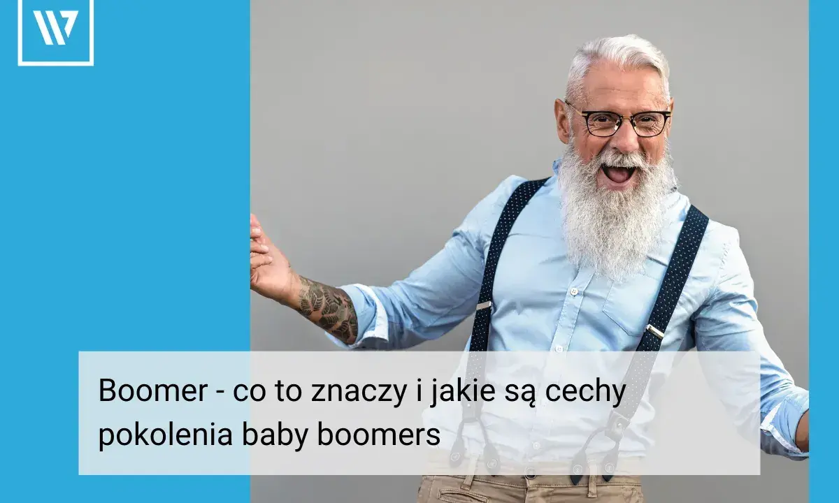 Uśmiechnięty mężczyzna z siwą brodą i tatuażami, symbol pokolenia boomers.