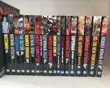 Rząd komiksów DC z postaciami takimi jak Watchmen, Batman, Superman i Wonder Woman.