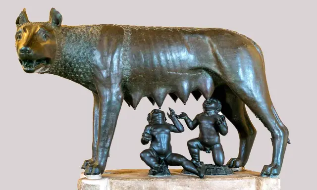 Wilczyca karmiąca Romulusa i Remusa, symboliczna scena z mitologii rzymskiej.